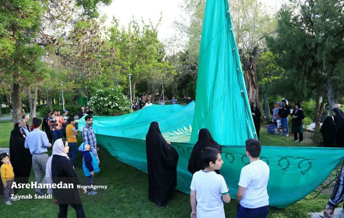 پرچم منقش به نام امام رضا(ع)در آسمان همدان